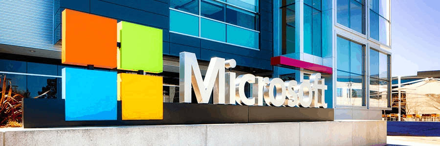 A large sign with Microsoft's logo and the word Microsoft in big, chrome letters.